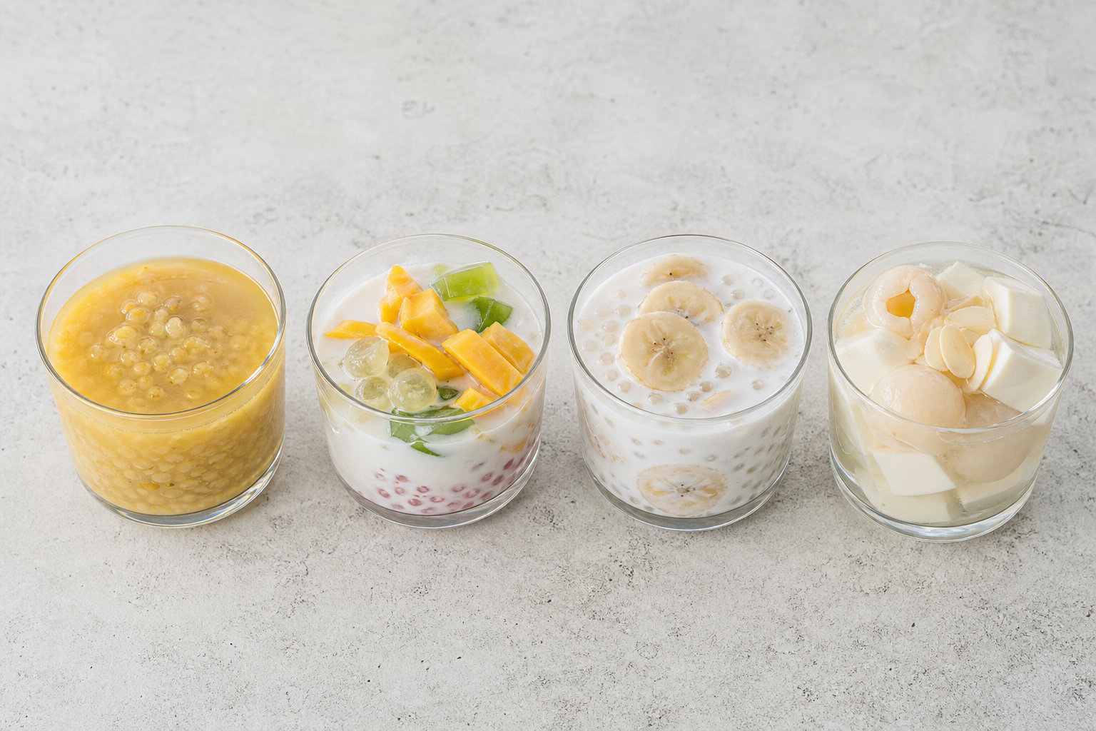 Four small glasses of Vietnamese chè: mung bean, chè thái, banana with tapioca, and chè khúc bạch