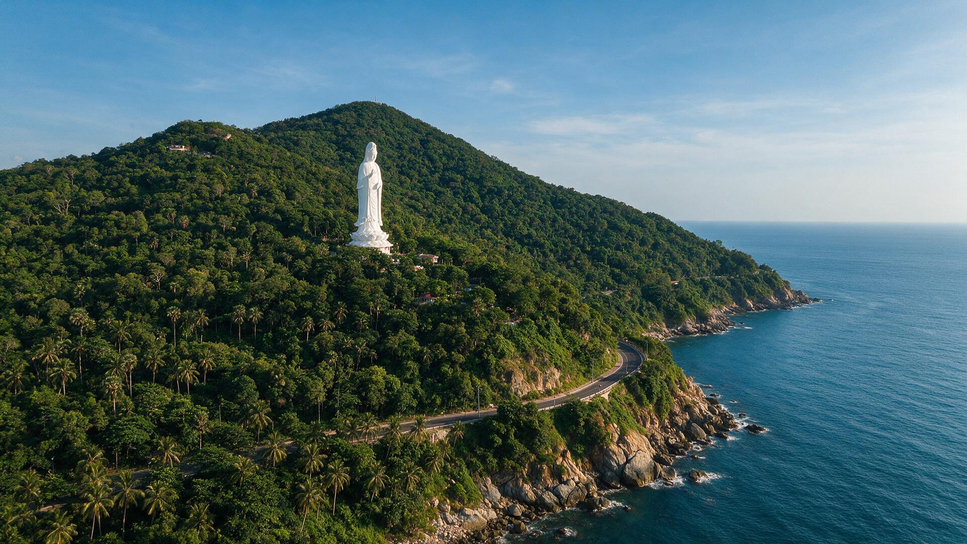 Son Tra Peninsula's forested mountain and the Lady Buddha statue overlooking the sea